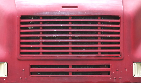 Close-up of grille on old grain truck.