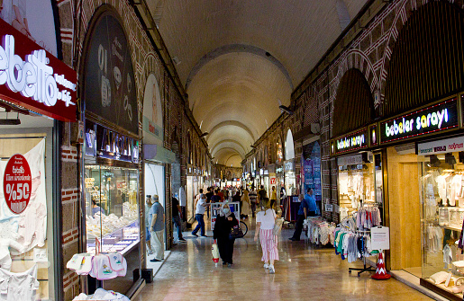 Bursa, Turkey - July 18, 2020: people at the entrance of famous Tarihi Ulu Carsi (Historical Grand Bazaar), covered shopping complex built in Ottoman Empire period in Bursa.