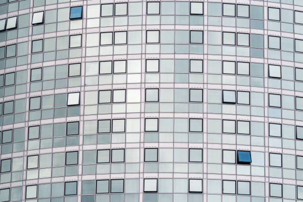 istock Reflective glass windows on a modern office and residential building 1263471571