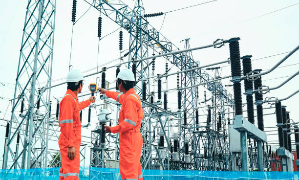 istock Electrical engineers used a thermometer to check for faults in equipment sets, Also known as preventive maintenance to reduce the damage of equipment, Concept to professional engineer on industrial 1263473314