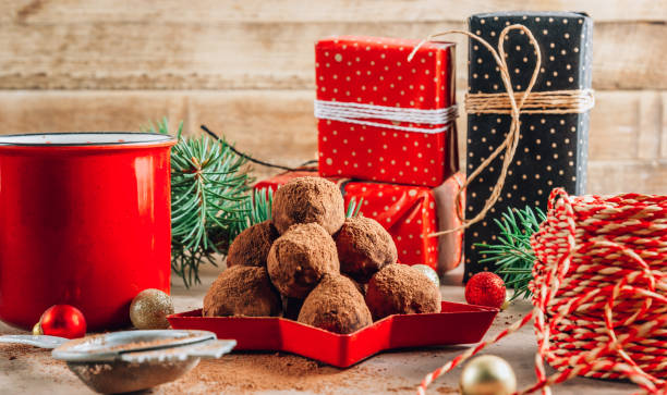 istock Homemade chocolate truffles candy ball on a christmas background. 1263474113