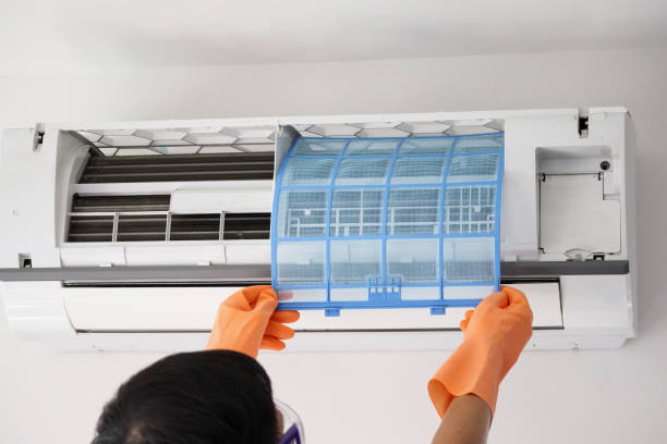 istock Asian man hand hold air conditioner filter cleaning concept 1263476694