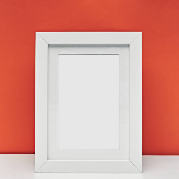 istock White frame for photos and drawings on a colored background. Interior Design. Mock up. 1263476821
