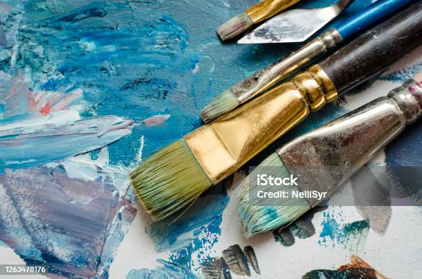 Artist Paint Brushes On The Wooden Palette Stock Photo - Download Image Now - Paintbrush, Artist, Painting - Art Product
