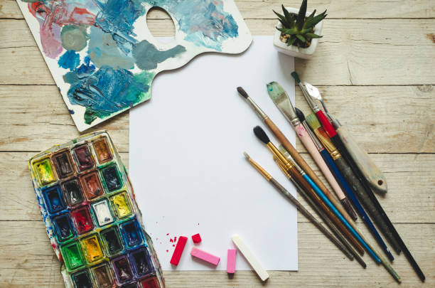 istock Creative artist workplace flat lay, mockup on wooden background 1263478182
