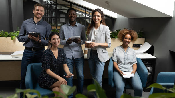 istock Portrait happy smiling diverse employees team in office 1263481515