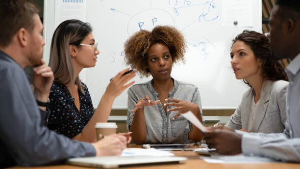 istock Diverse employees team with African American leader discussing project 1263482586