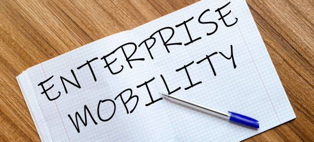 istock Blank notebook and pen. Isolated on white. whith text Enterprise Mobility 1263483112