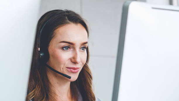 istock Business people wearing headset working in office 1263483852