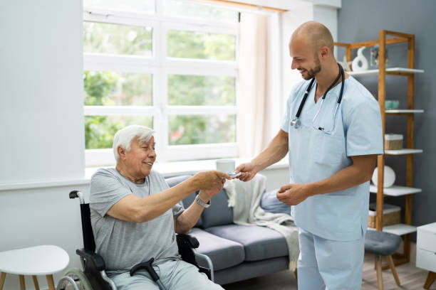 istock Old Patient Home Care Nurse 1263483858