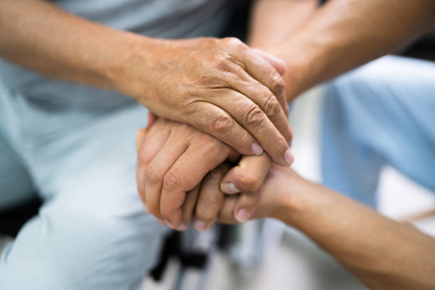 istock Elder Patient Helping Nurse Hand 1263483897