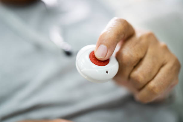 istock Close-up Of Senior Man Pressing Alarm Button 1263483907