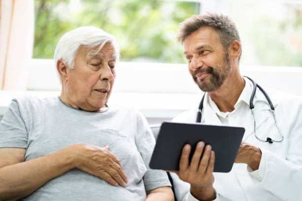 istock Home Care Elder Patient Looking At XRay Images 1263483944