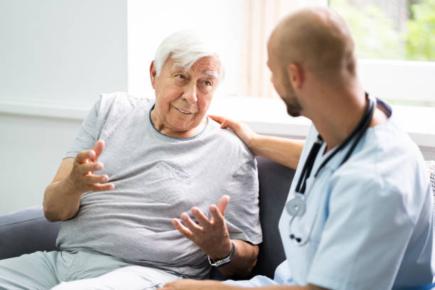 istock Old Senior Home Care Patient With Nurse 1263483951