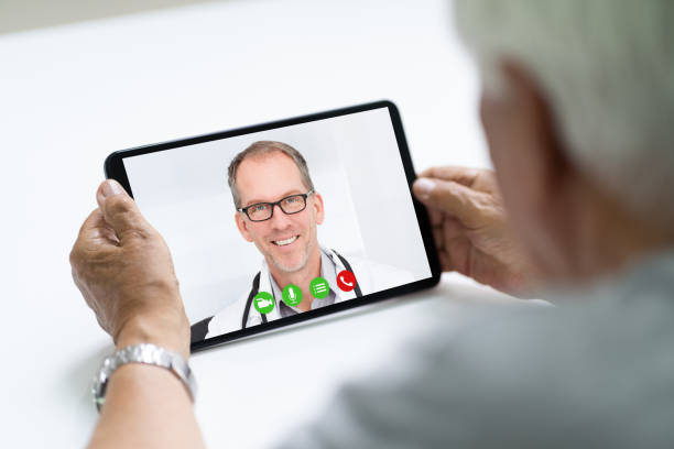 istock Senior Man In Videochat Or Videoconference With Doctor 1263483958