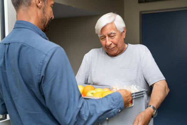 istock Grocery Food Shopping Help For Elder Senior Standing 1263483973