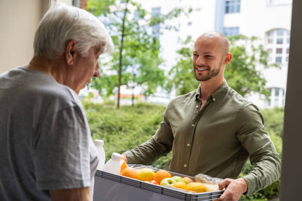 istock Grocery Food Shopping Help For Elder Senior Standing 1263483975