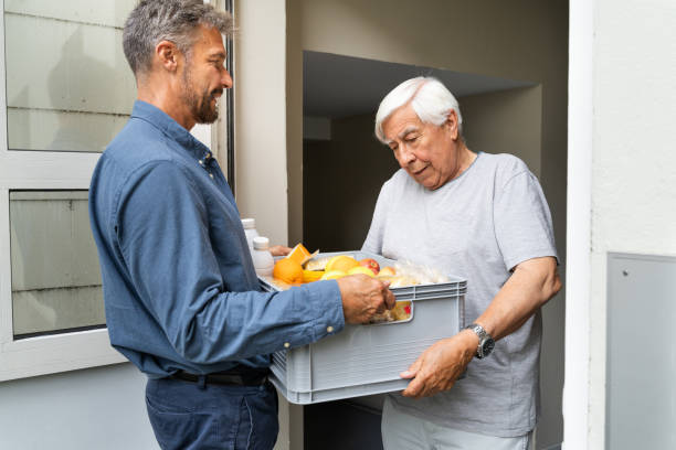 istock Grocery Food Shopping Help For Elder Senior Standing 1263483976