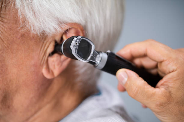 istock Otolaryngology Check. Doctor Checking Ear 1263484004