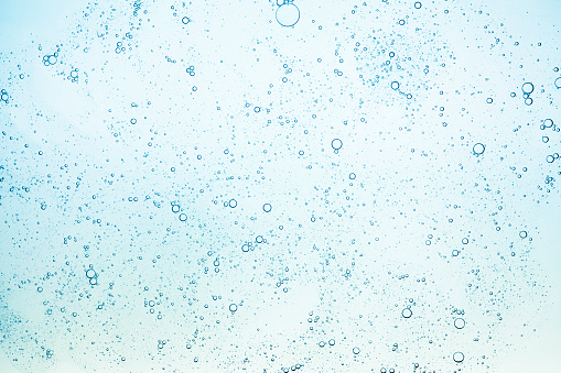 Azul verde gris turquesa transparente transparente líquido cosmético gel de enfriamiento de loción tónica lubricante gris fondo multicolor photo