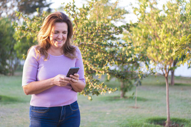 istock Woman hanging a mobile phone. 1263487378