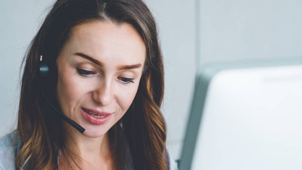 istock Business people wearing headset working in office 1263487502
