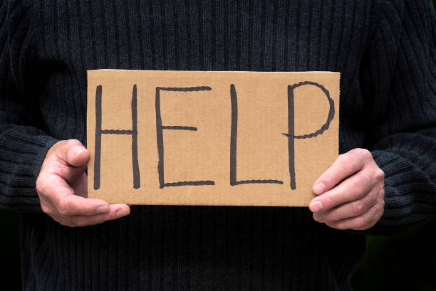 istock Close-up man holding homemade sign Help 1263488044