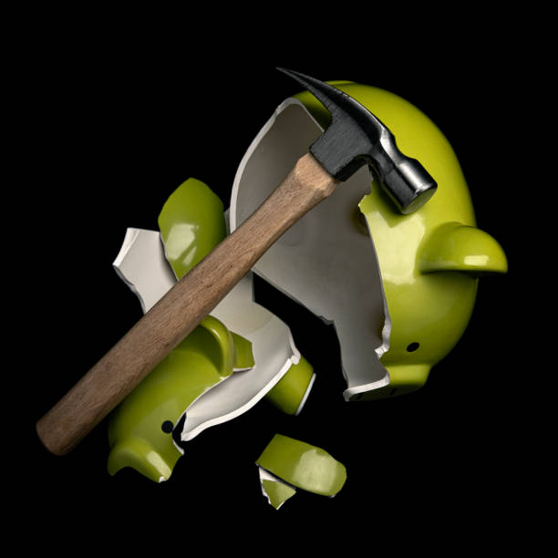 istock Broken Piggy Bank Emptied on a black background 1263489017