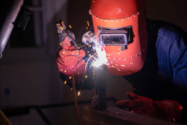 istock Metal welding steel works using electric arc welding machine 1263492127