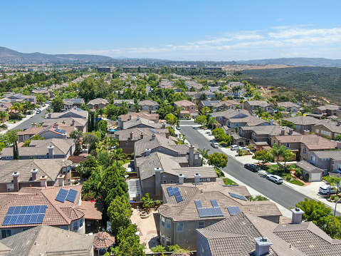 Aerial view of middle class residential villas with solar panel on the roof, San Diego County, California, USA.