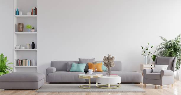 istock Modern living room interior with sofa and green plants,lamp,table on white wall background. 1263494737