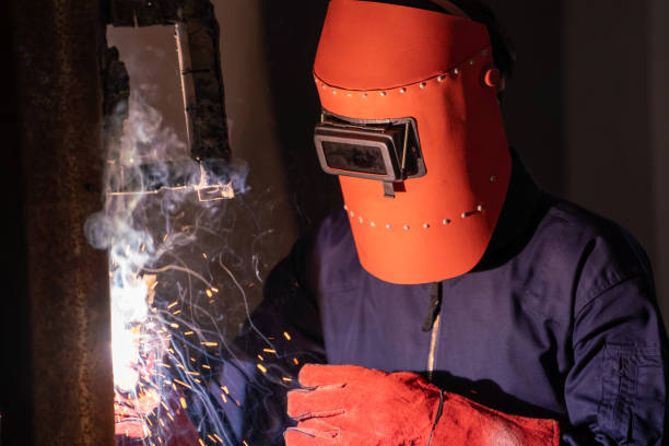 istock Metal welding steel works using electric arc welding machine 1263496231