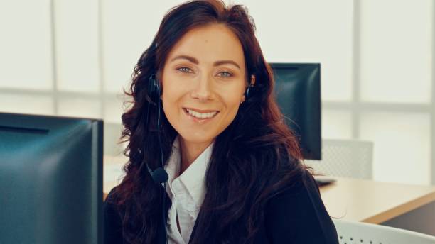 istock Business people wearing headset working in office 1263496465