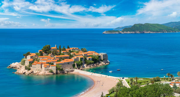 sveti stefan insel in budva - scenics building exterior tourist resort orange stock-fotos und bilder