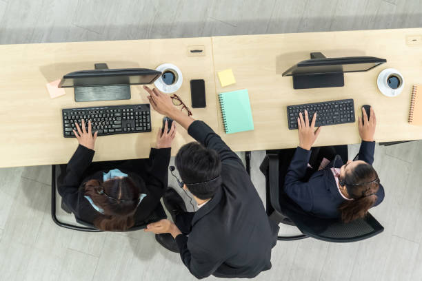 istock Business people wearing headset shot from top view 1263515105