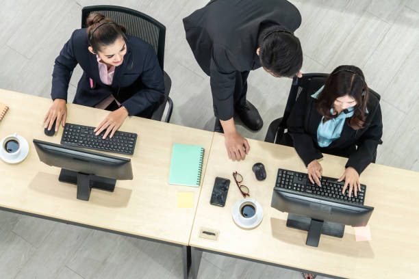 istock Business people wearing headset from top view in office working with computer 1263517077