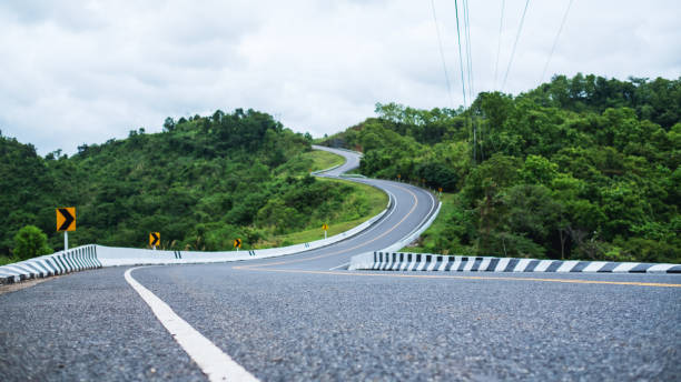 istock Curved and winding asphalt road 1263517186