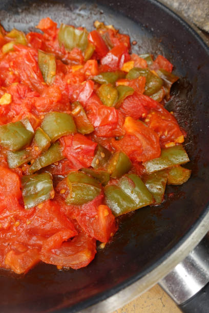 istock Culinary preparation based on tomatoes and fried green peppers  Mediterranean cuisine 1263517269