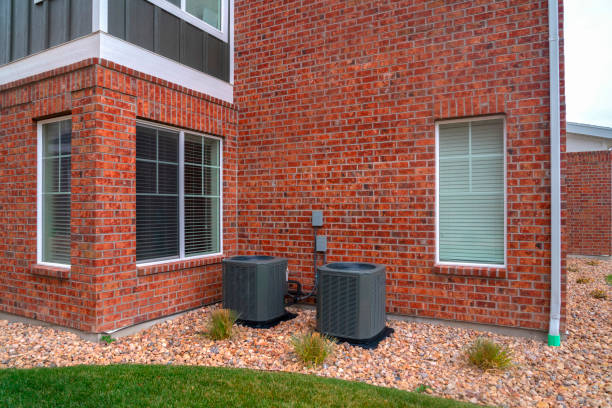 istock Corner brick wall to a building with two bins 1263517917
