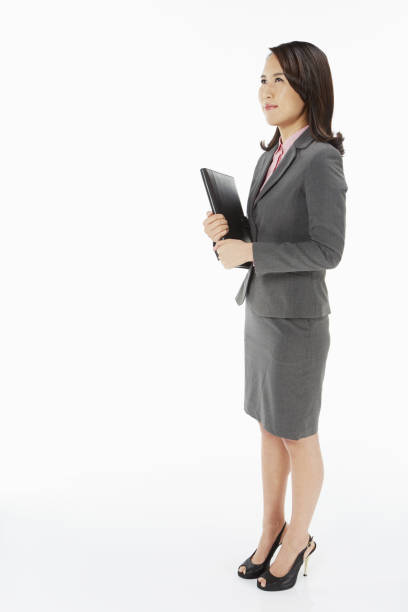 istock Businesswoman carrying a folder 1263517929