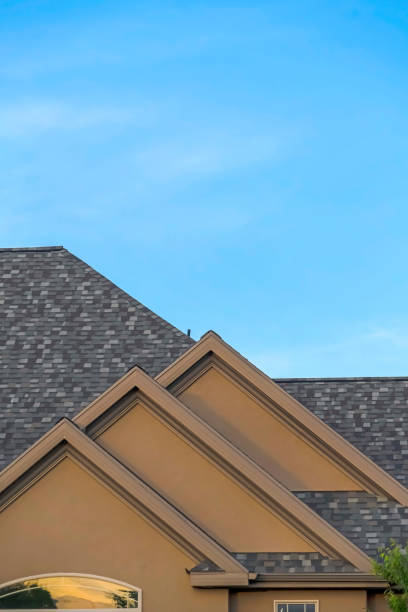 istock Home exterior with front gable roof and transom window against blue sky 1263517998