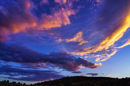 Wide Angle Sky with Sunset Clouds Landscape - Mountain views with vibrant colorful clouds.