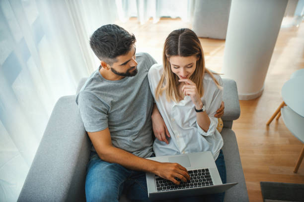 istock Young couple staying in touch with family during coronavirus quarantine. 1263520989