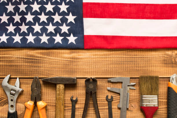 istock Labor day. American flag and various tools on a wooden table. 1263525752