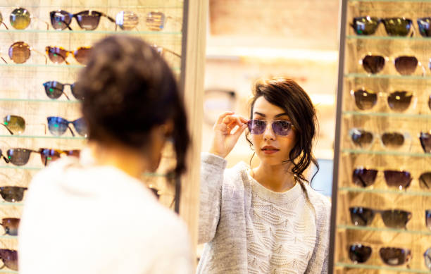 istock happy woman trying some eyeglasses 1263532992