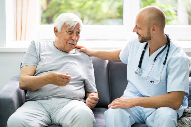 istock Old Senior Home Care Patient With Nurse 1263536811