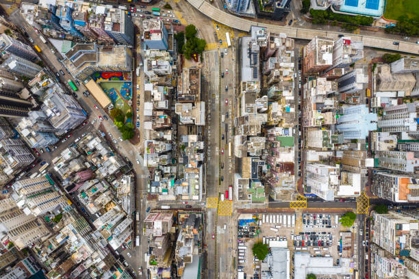 istock Streets in Mongkok district. Architecture and transportation background. Aerial view of skyscraper buildings in Hong Kong, Top view 1263538490