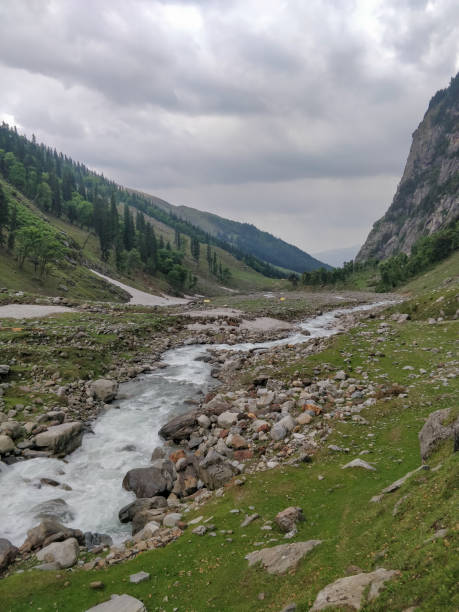 istock Beautiful river stream flowing through rocks in an epic Indian Himalayan Mountain Valley. 1263539177