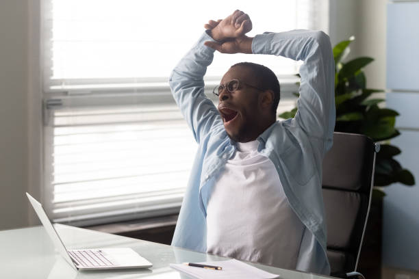 istock African american businessman with hands behind head resting. 1263543123