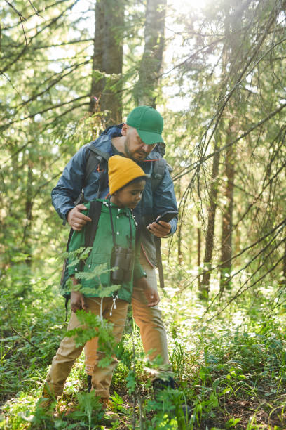 istock Family using phone in the forest 1263547481